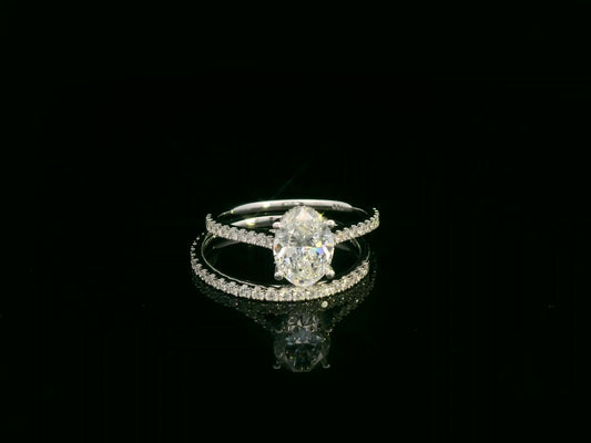 18K white gold oval diamond bridal ring set with IGI certified diamond and matching wedding band by Emirates Diamonds.