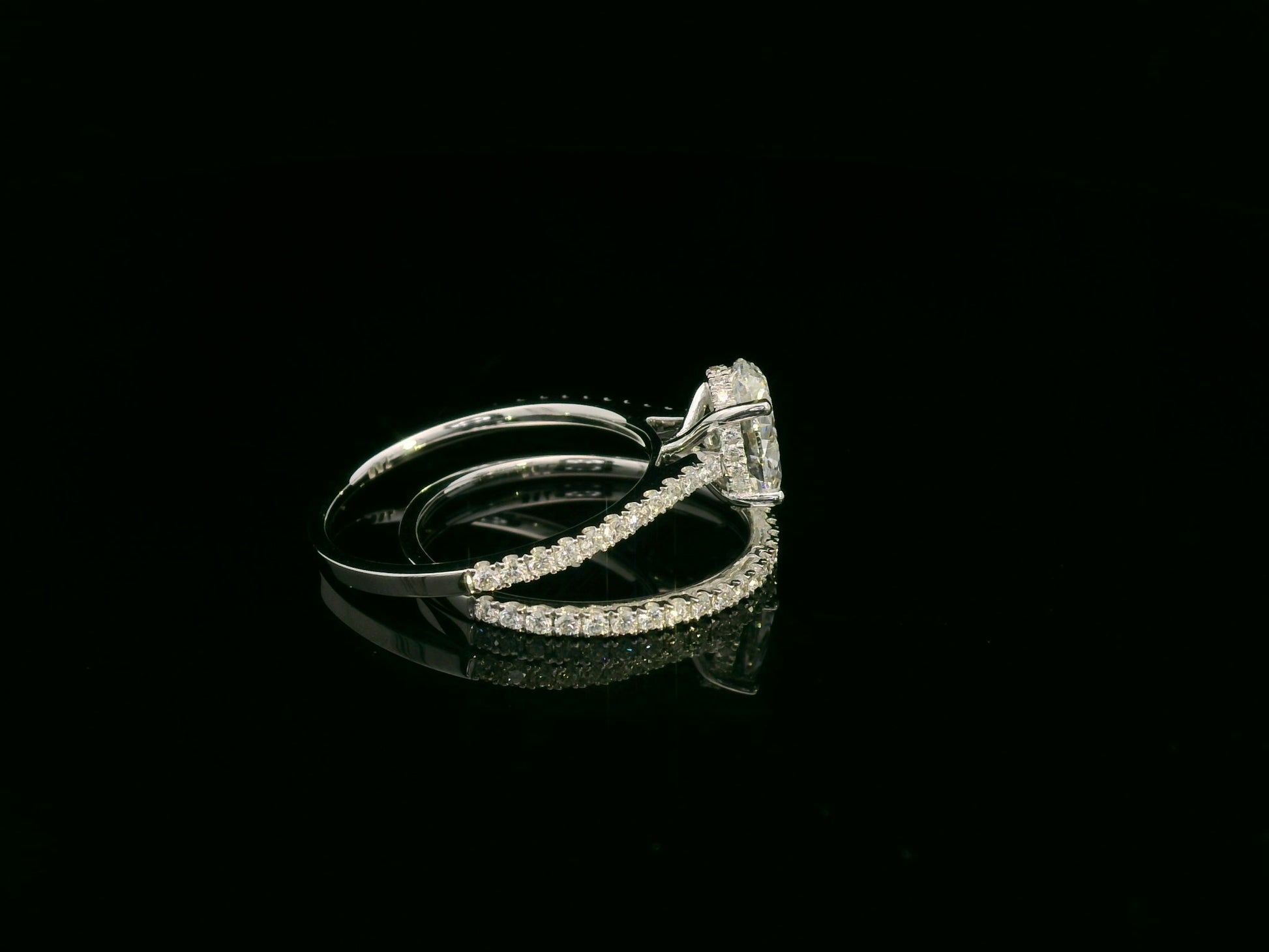 18K white gold oval diamond bridal ring set with IGI certified diamond and matching wedding band by Emirates Diamonds.