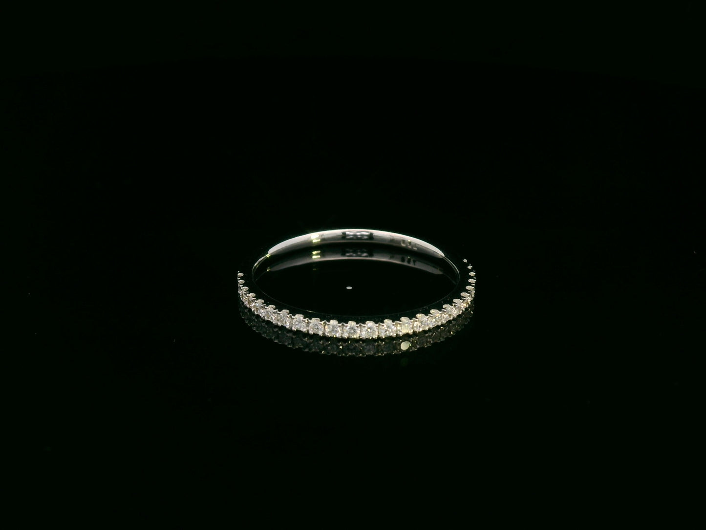 18K white gold oval diamond bridal ring set with IGI certified diamond and matching wedding band by Emirates Diamonds.