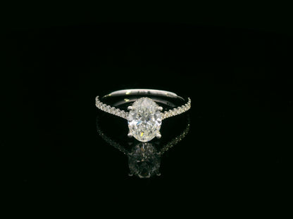 18K white gold oval diamond bridal ring set with IGI certified diamond and matching wedding band by Emirates Diamonds.