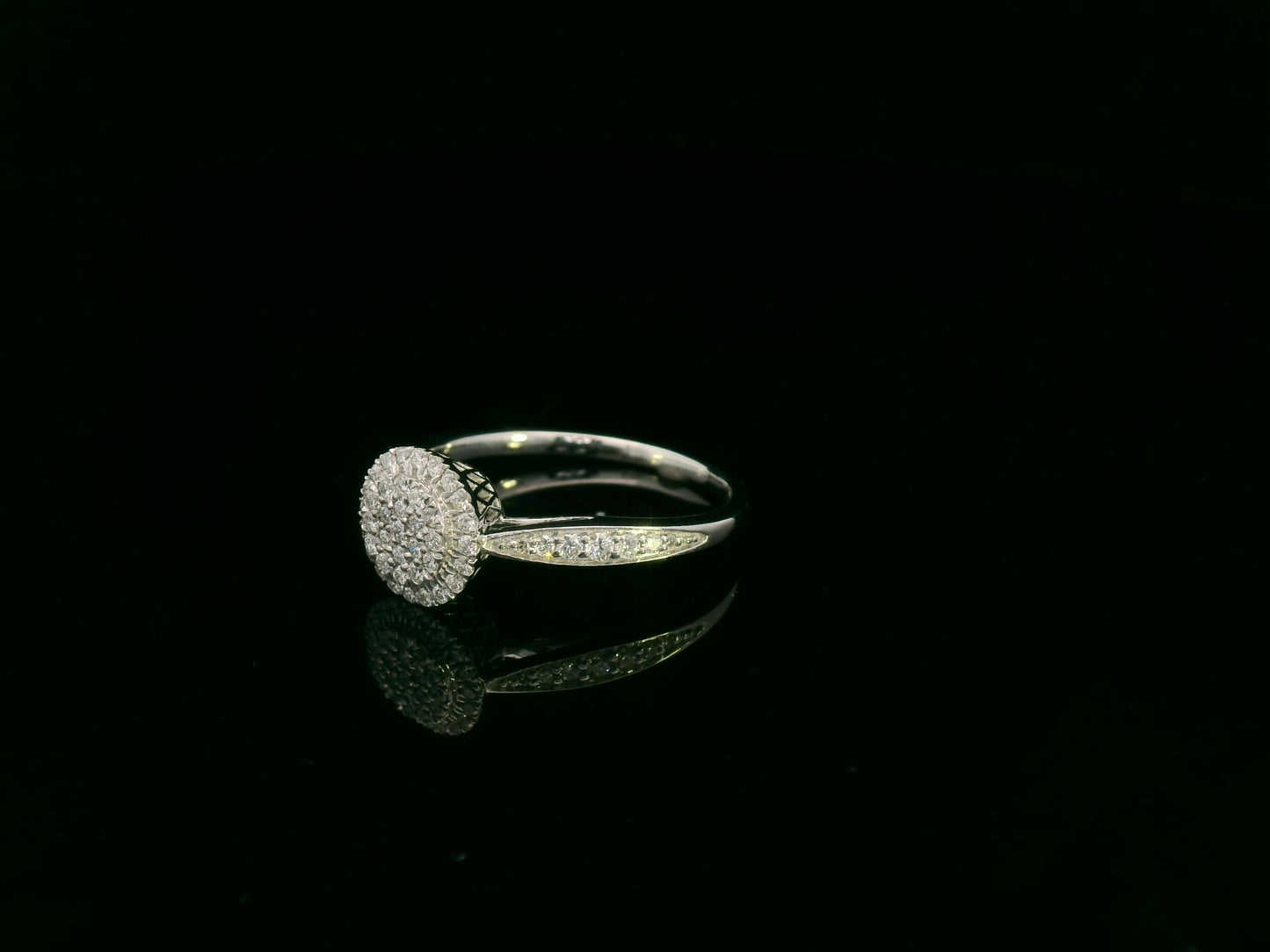 0.38 carat diamond cluster halo ring in 18K white gold with pavé band by Emirates Diamonds