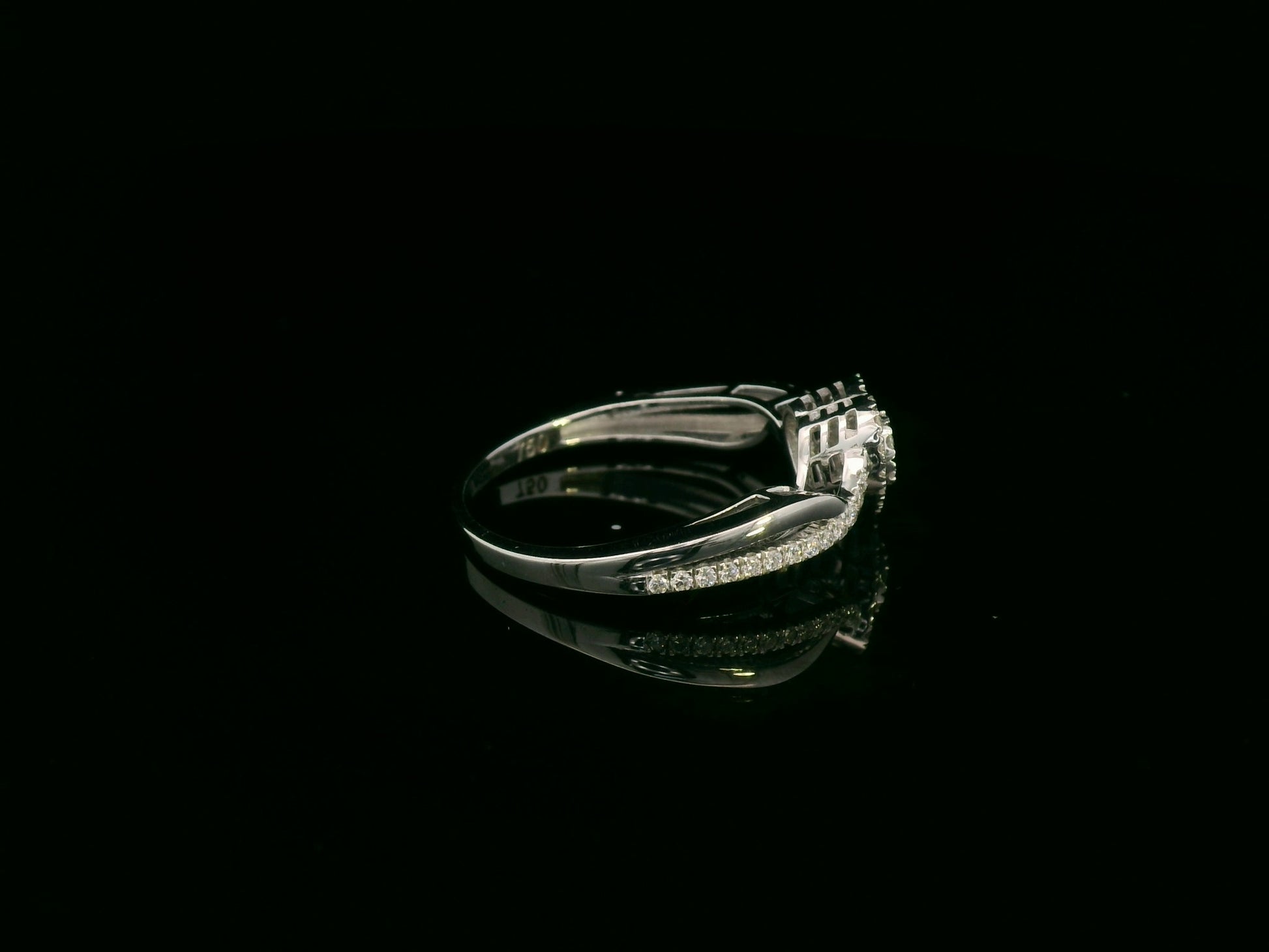 Heart-shaped diamond cluster ring in 18K white gold with pavé diamond band by Emirates Diamonds.