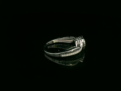 Heart-shaped diamond cluster ring in 18K white gold with pavé diamond band by Emirates Diamonds.