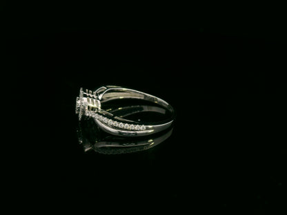 Heart-shaped diamond cluster ring in 18K white gold with pavé diamond band by Emirates Diamonds.