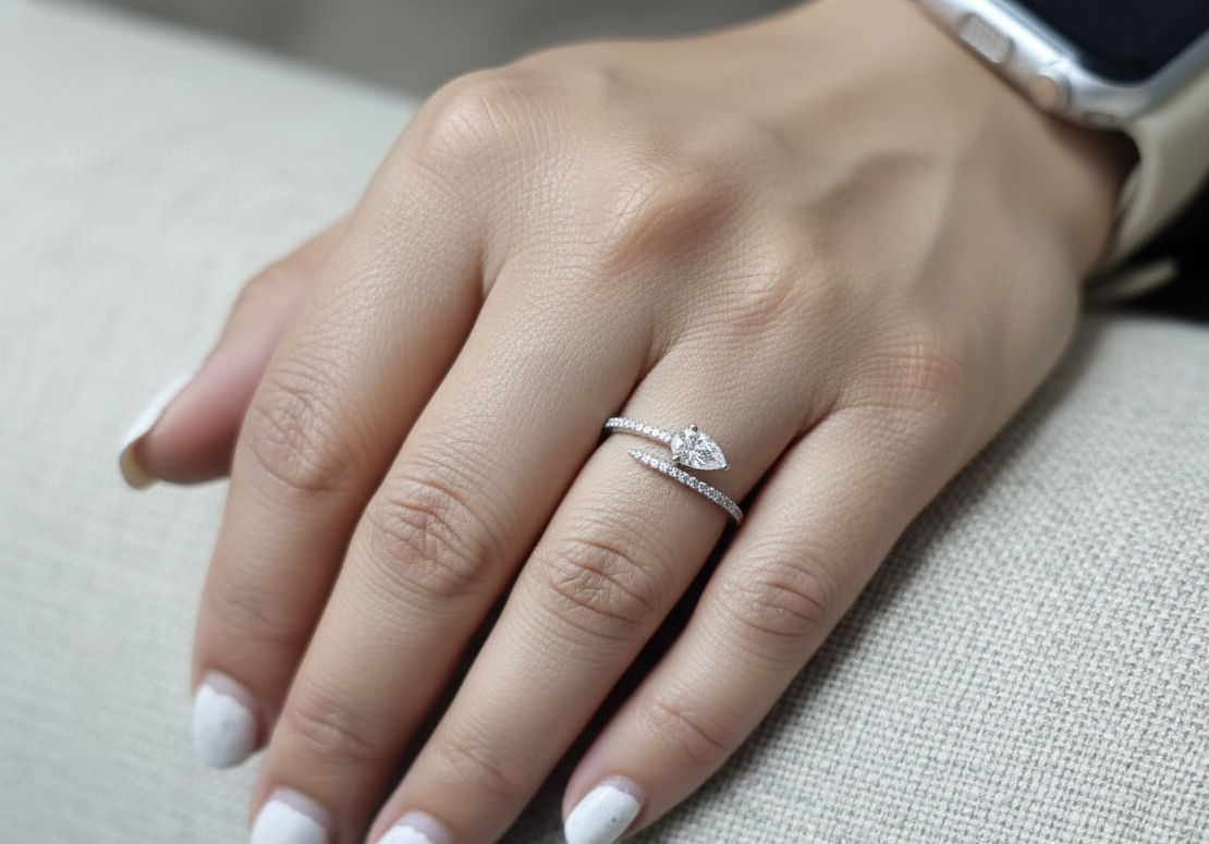 18K white gold diamond bypass ring with pear-cut diamond on one end and pavé diamond sweep, total diamond weight 0.43 carat – Emirates Diamonds