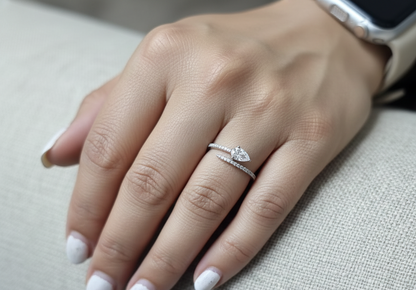 18K white gold diamond bypass ring with pear-cut diamond on one end and pavé diamond sweep, total diamond weight 0.43 carat – Emirates Diamonds