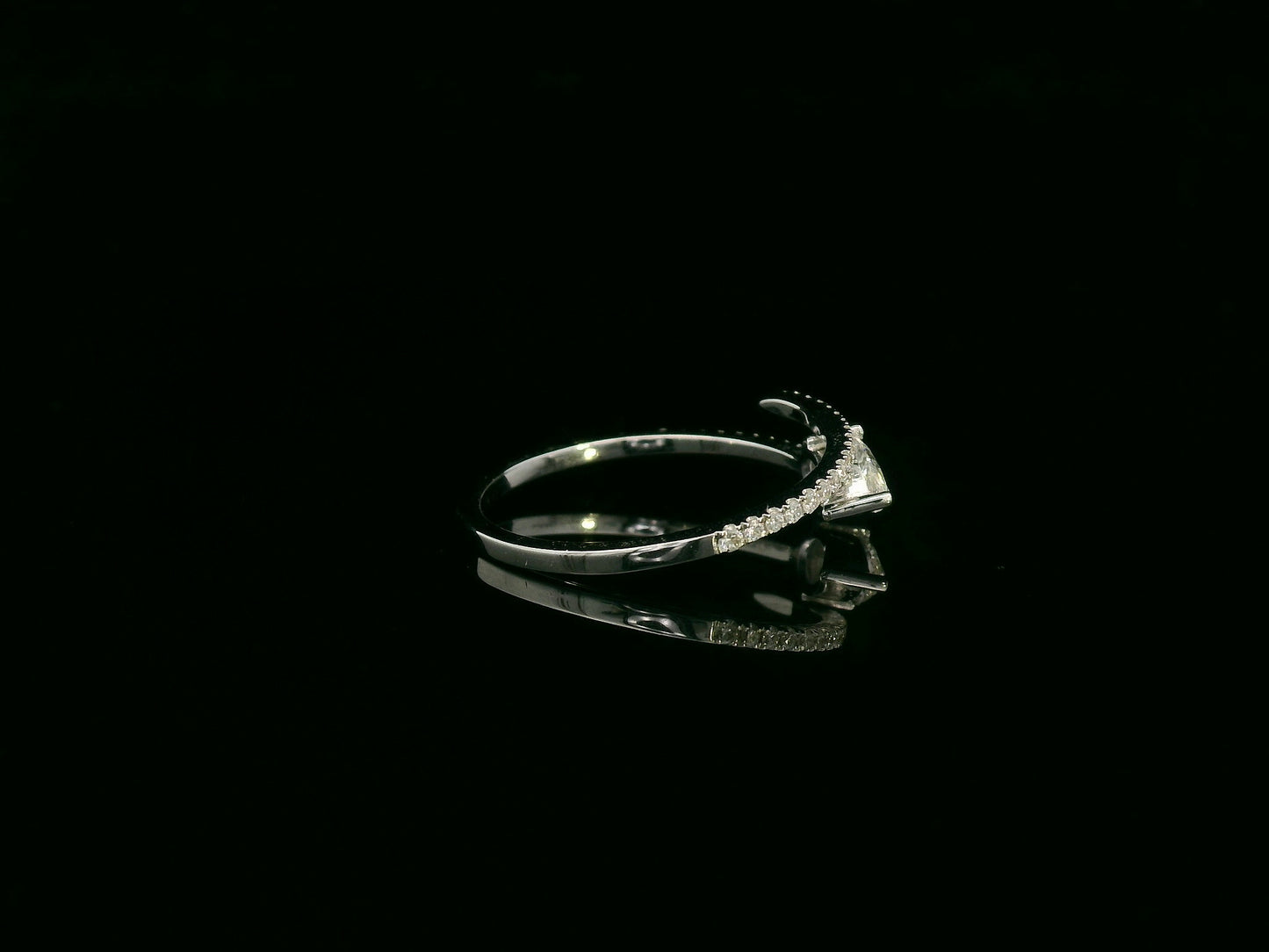 18K white gold diamond bypass ring with pear-cut diamond on one end and pavé diamond sweep, total diamond weight 0.43 carat – Emirates Diamonds