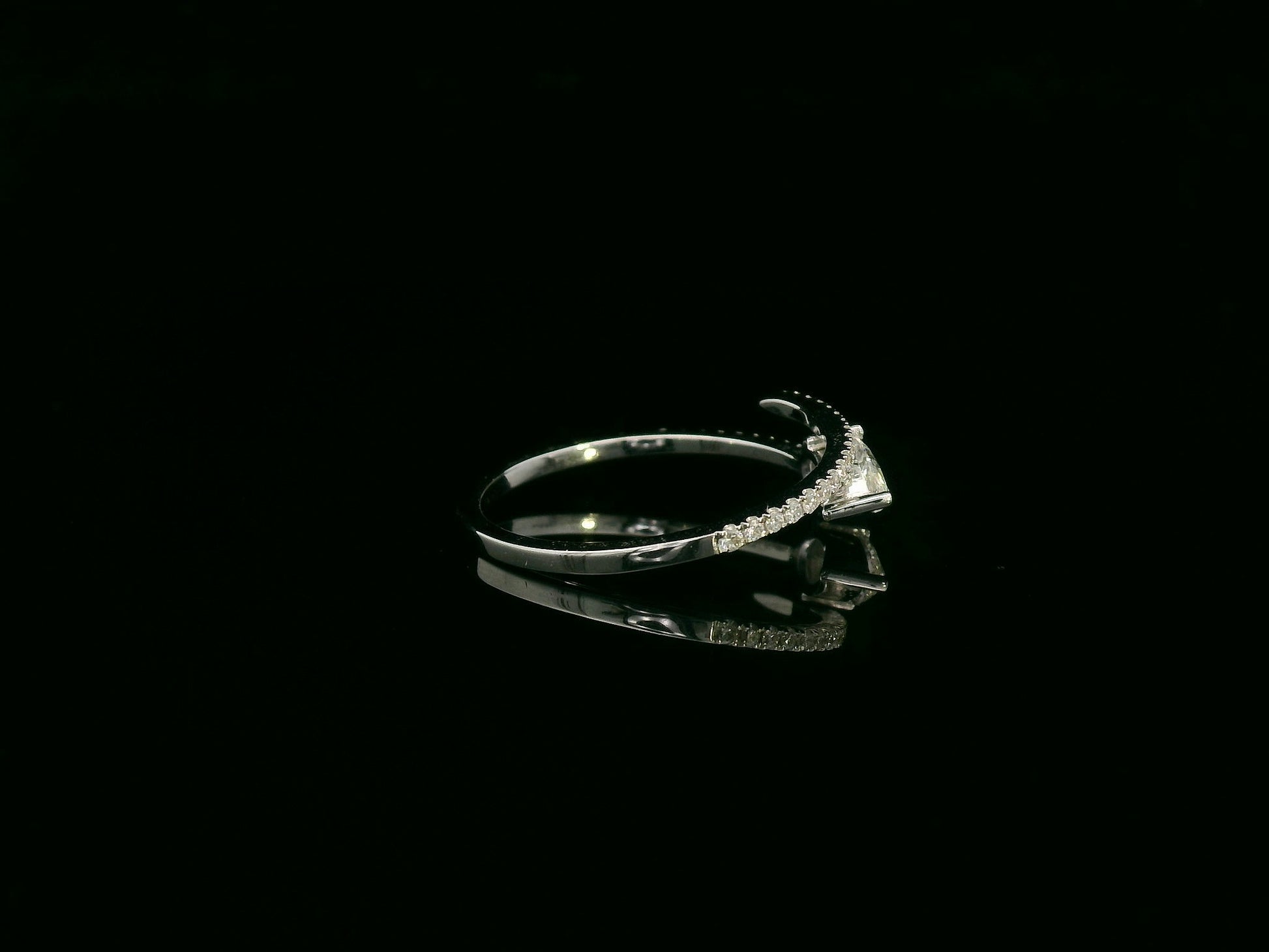 18K white gold diamond bypass ring with pear-cut diamond on one end and pavé diamond sweep, total diamond weight 0.43 carat – Emirates Diamonds