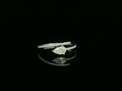 18K white gold diamond bypass ring with pear-cut diamond on one end and pavé diamond sweep, total diamond weight 0.43 carat – Emirates Diamonds