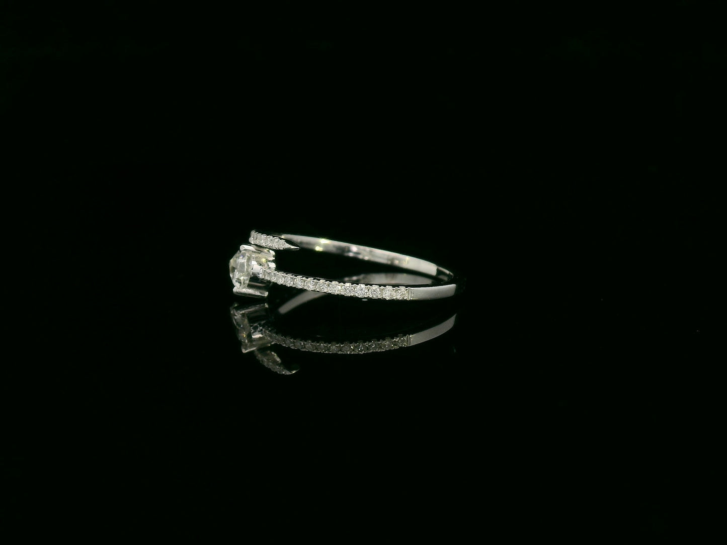 18K white gold diamond bypass ring with pear-cut diamond on one end and pavé diamond sweep, total diamond weight 0.43 carat – Emirates Diamonds