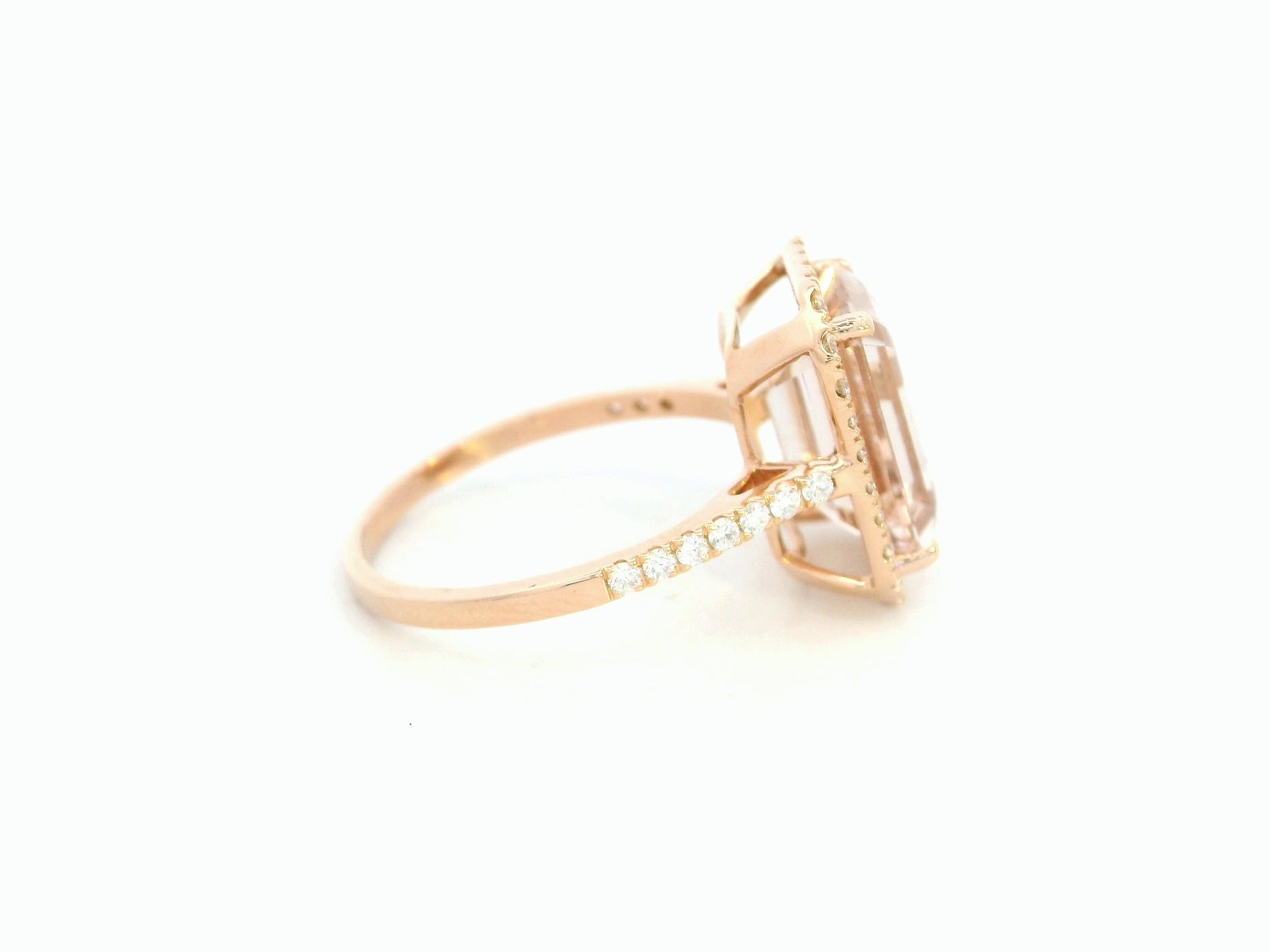 18K rose gold emerald-cut morganite ring with diamond halo and diamond band by Emirates Diamonds