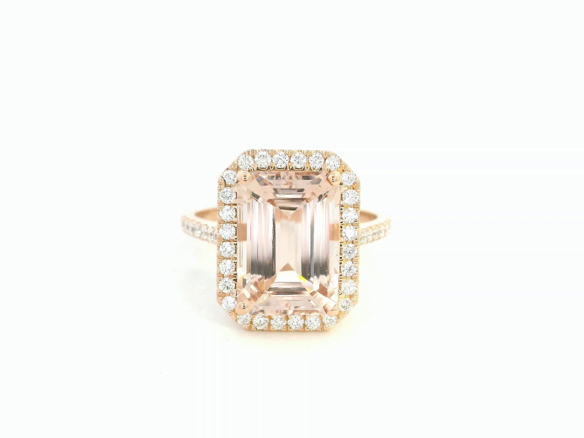 18K rose gold emerald-cut morganite ring with diamond halo and diamond band by Emirates Diamonds