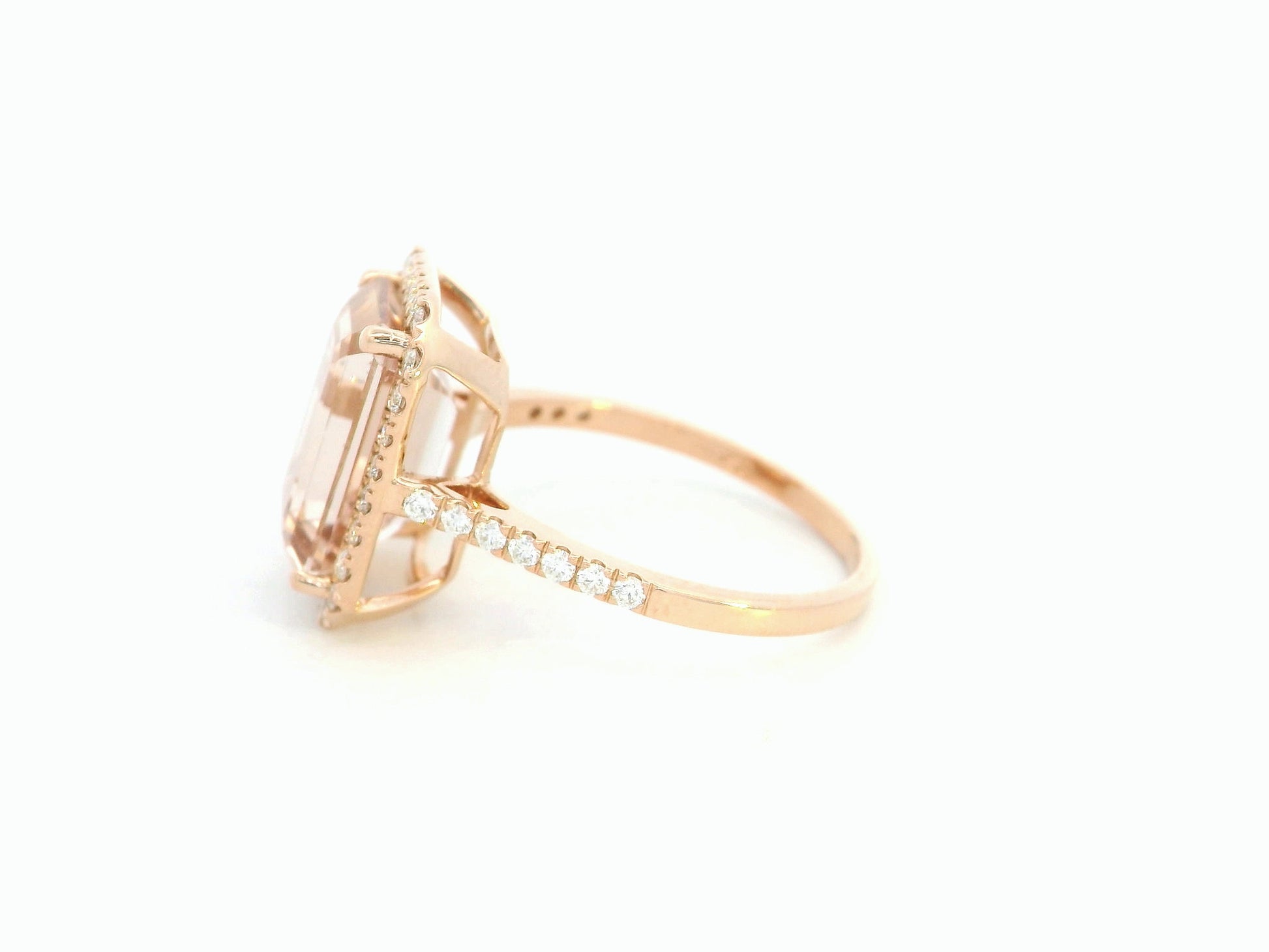 18K rose gold emerald-cut morganite ring with diamond halo and diamond band by Emirates Diamonds