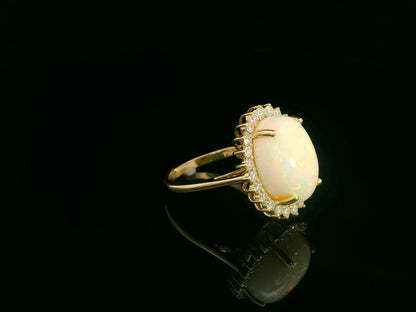 18K yellow gold oval opal ring with diamond halo, 4.85 carat opal fine jewelry by Emirates Diamonds