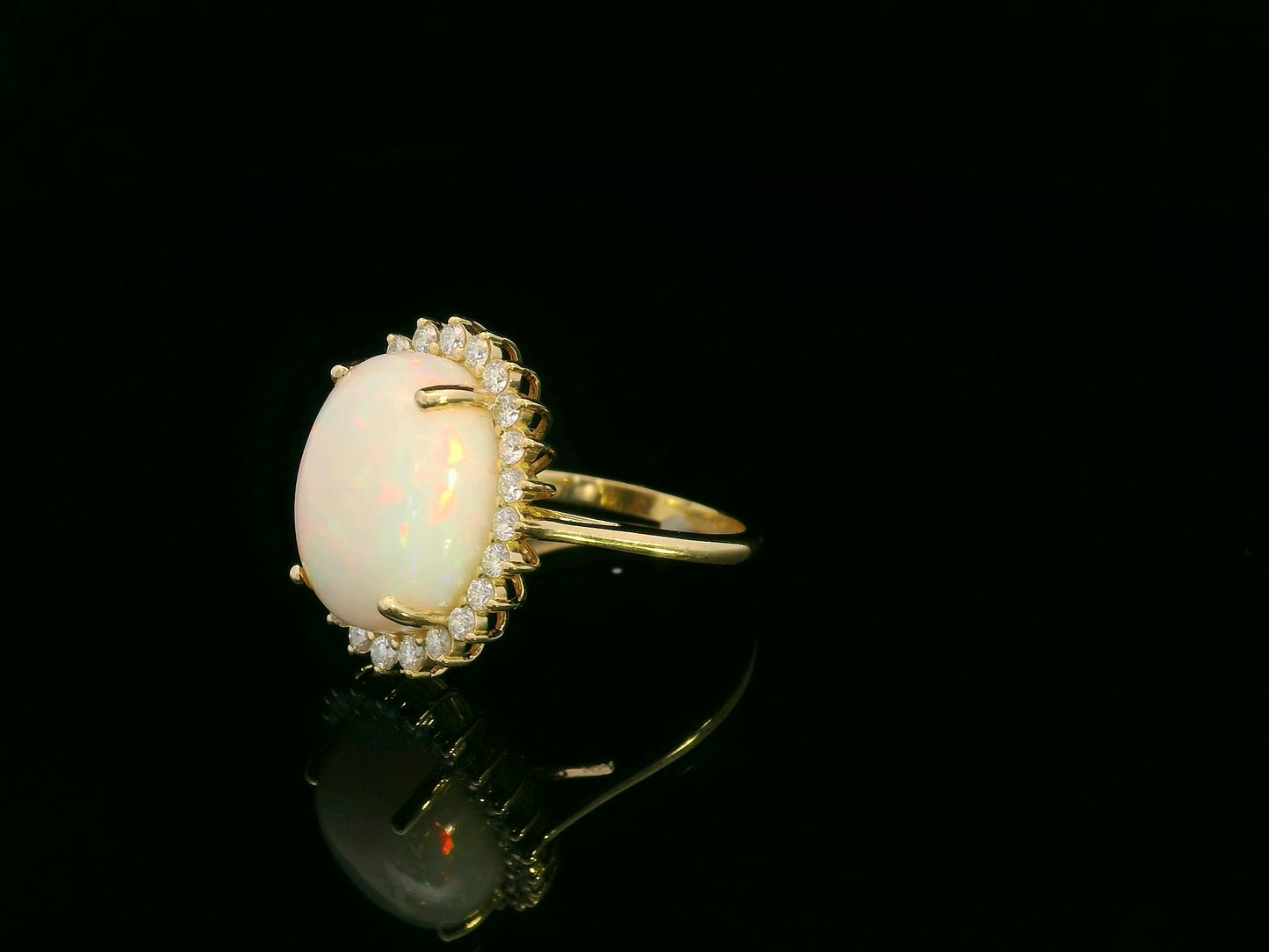 18K yellow gold oval opal ring with diamond halo, 4.85 carat opal fine jewelry by Emirates Diamonds