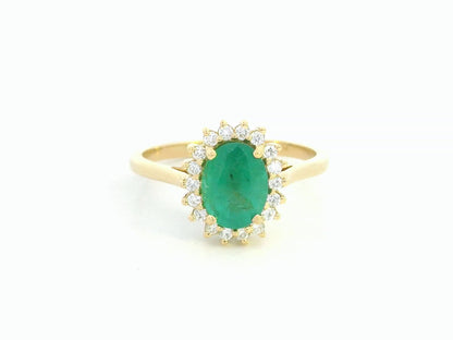 Oval emerald diamond halo ring in 18K yellow gold by Emirates Diamonds