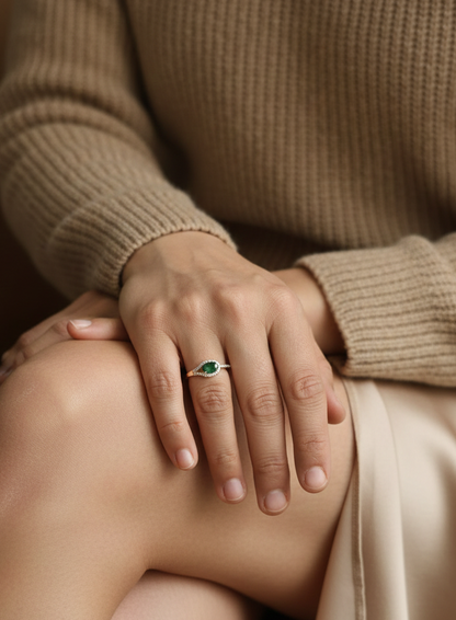 18K yellow gold ring featuring 0.59 carat oval emerald with 0.21 carat diamond accents by Emirates Diamonds.