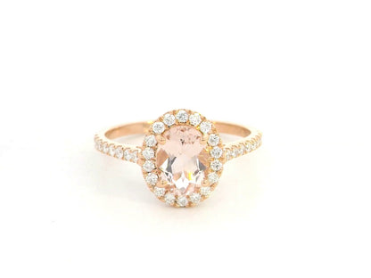 18K rose gold oval morganite ring with diamond halo and pavé band by Emirates Diamonds