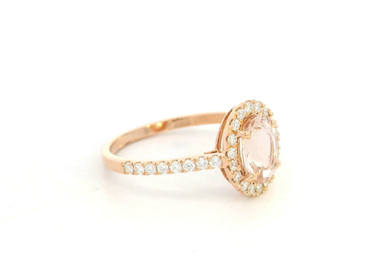 18K rose gold oval morganite ring with diamond halo and pavé band by Emirates Diamonds