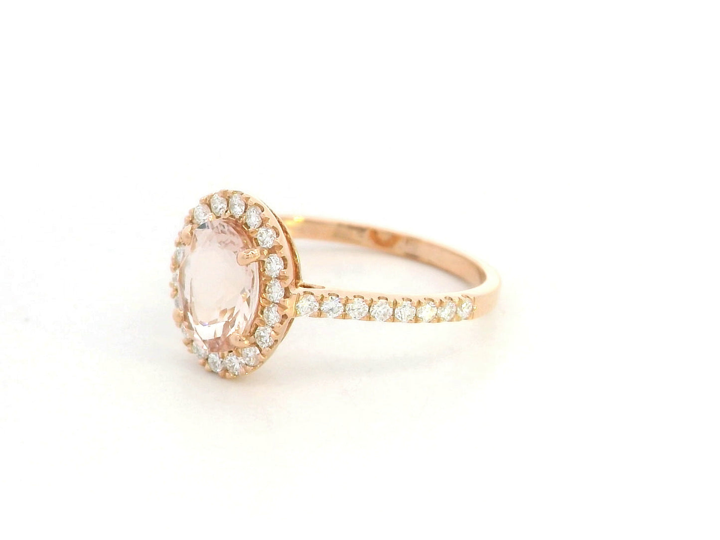 18K rose gold oval morganite ring with diamond halo and pavé band by Emirates Diamonds