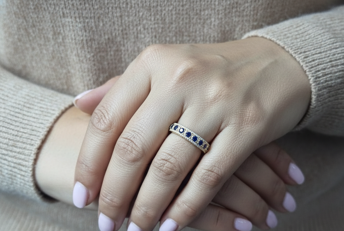 Blue sapphire and diamond band ring in 18K yellow gold by Emirates Diamonds
