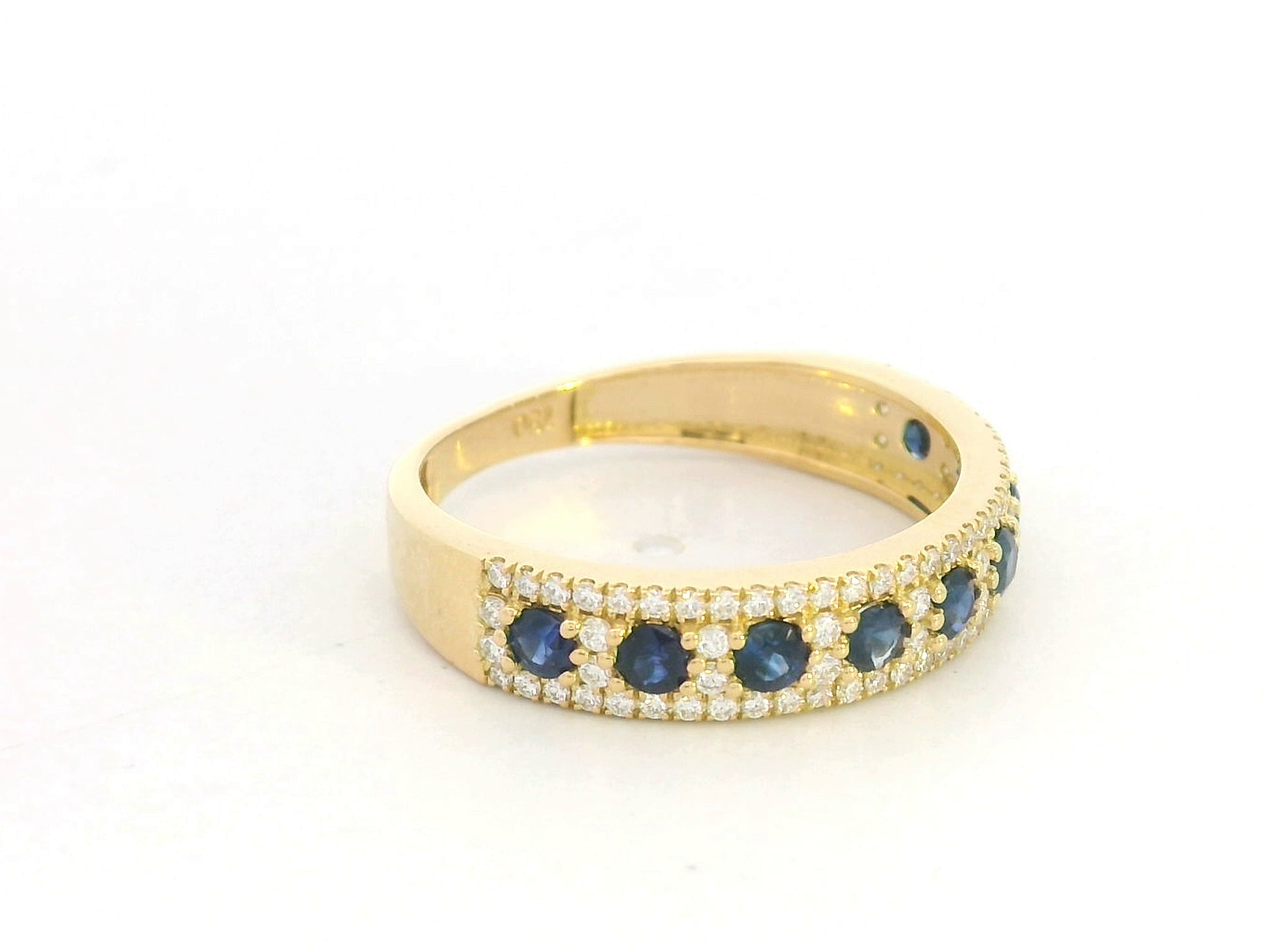 Blue sapphire and diamond band ring in 18K yellow gold by Emirates Diamonds