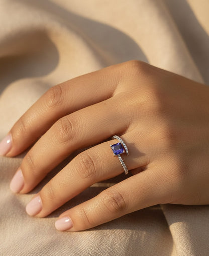 0.57 carat square emerald-cut tanzanite and diamond crossover ring in 18K white gold by Emirates Diamonds