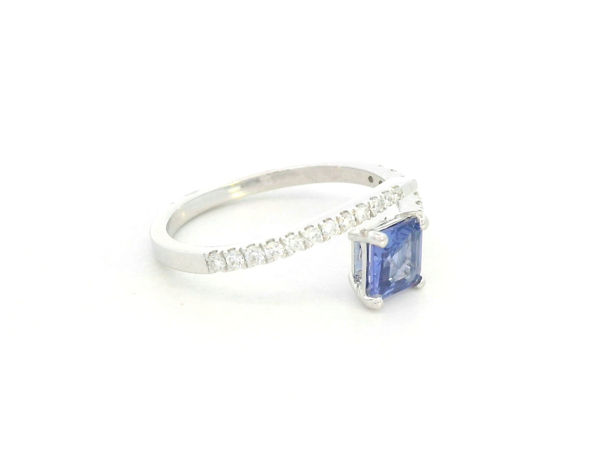 0.57 carat square emerald-cut tanzanite and diamond crossover ring in 18K white gold by Emirates Diamonds