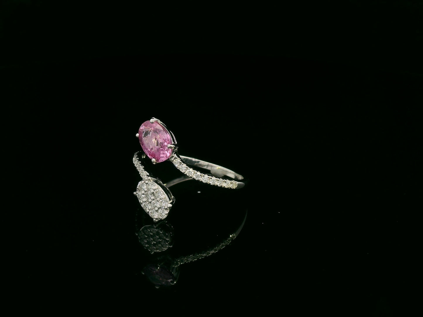 Pink sapphire diamond open wrap ring in 18K white gold with oval pink sapphire and diamond cluster
