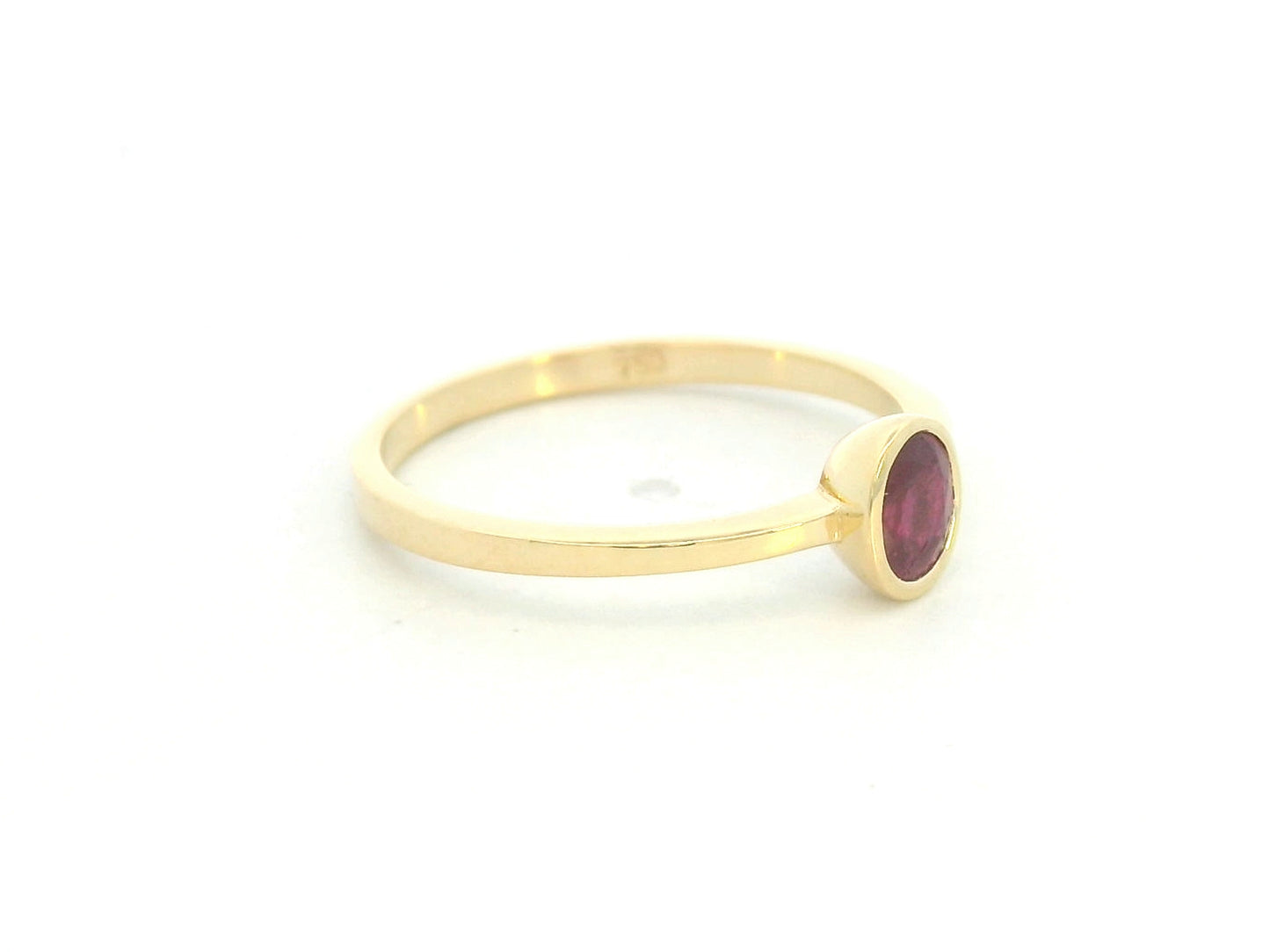 18K yellow gold ruby solitaire ring with bezel setting by Emirates Diamonds