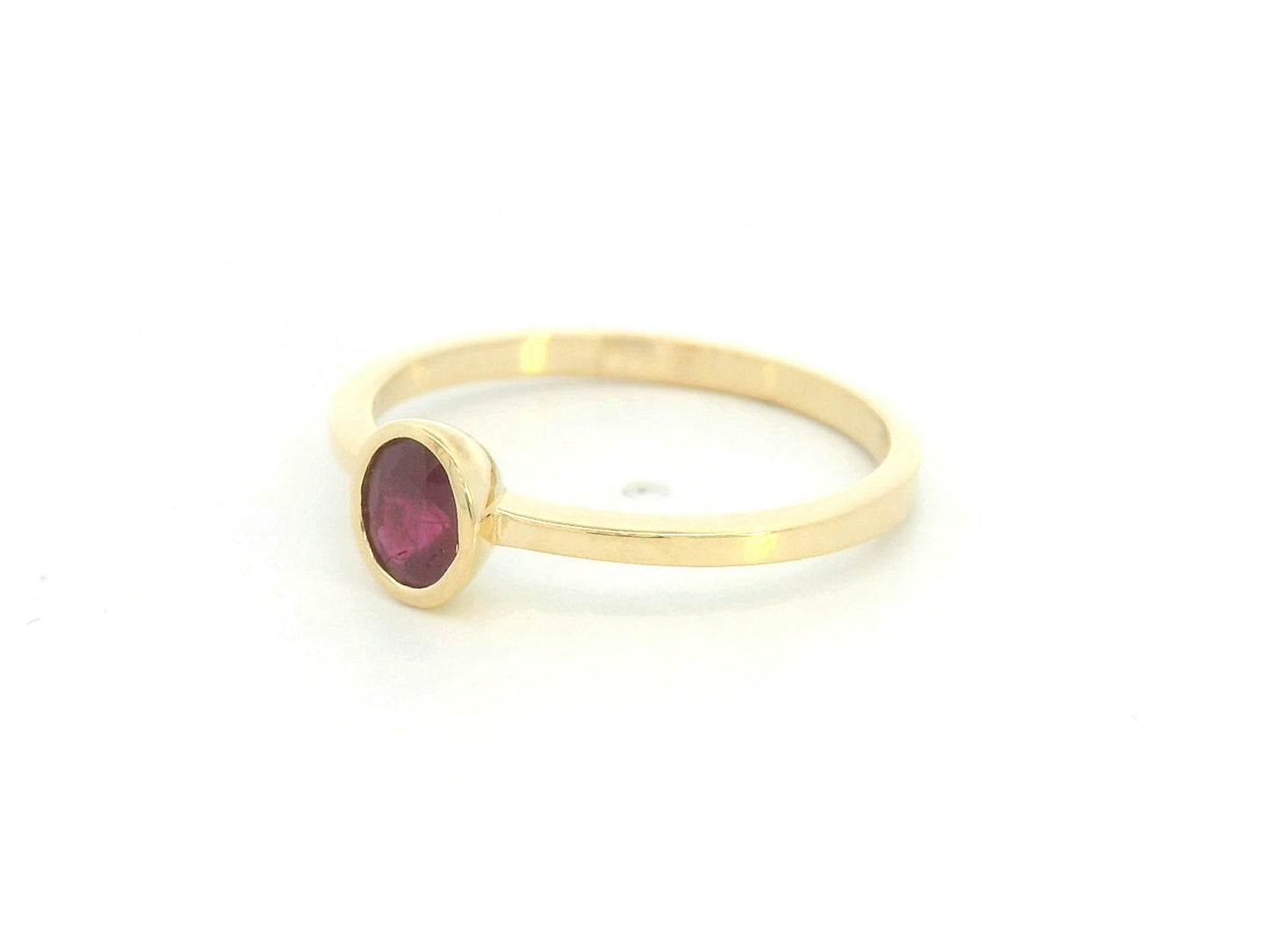 18K yellow gold ruby solitaire ring with bezel setting by Emirates Diamonds