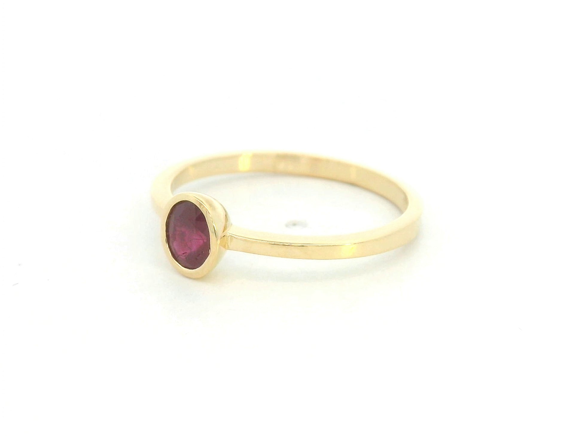 18K yellow gold ruby solitaire ring with bezel setting by Emirates Diamonds