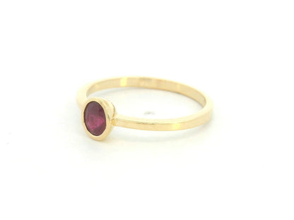 18K yellow gold ruby solitaire ring with bezel setting by Emirates Diamonds