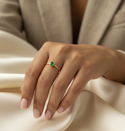 18K yellow gold emerald solitaire ring with bezel setting by Emirates Diamonds