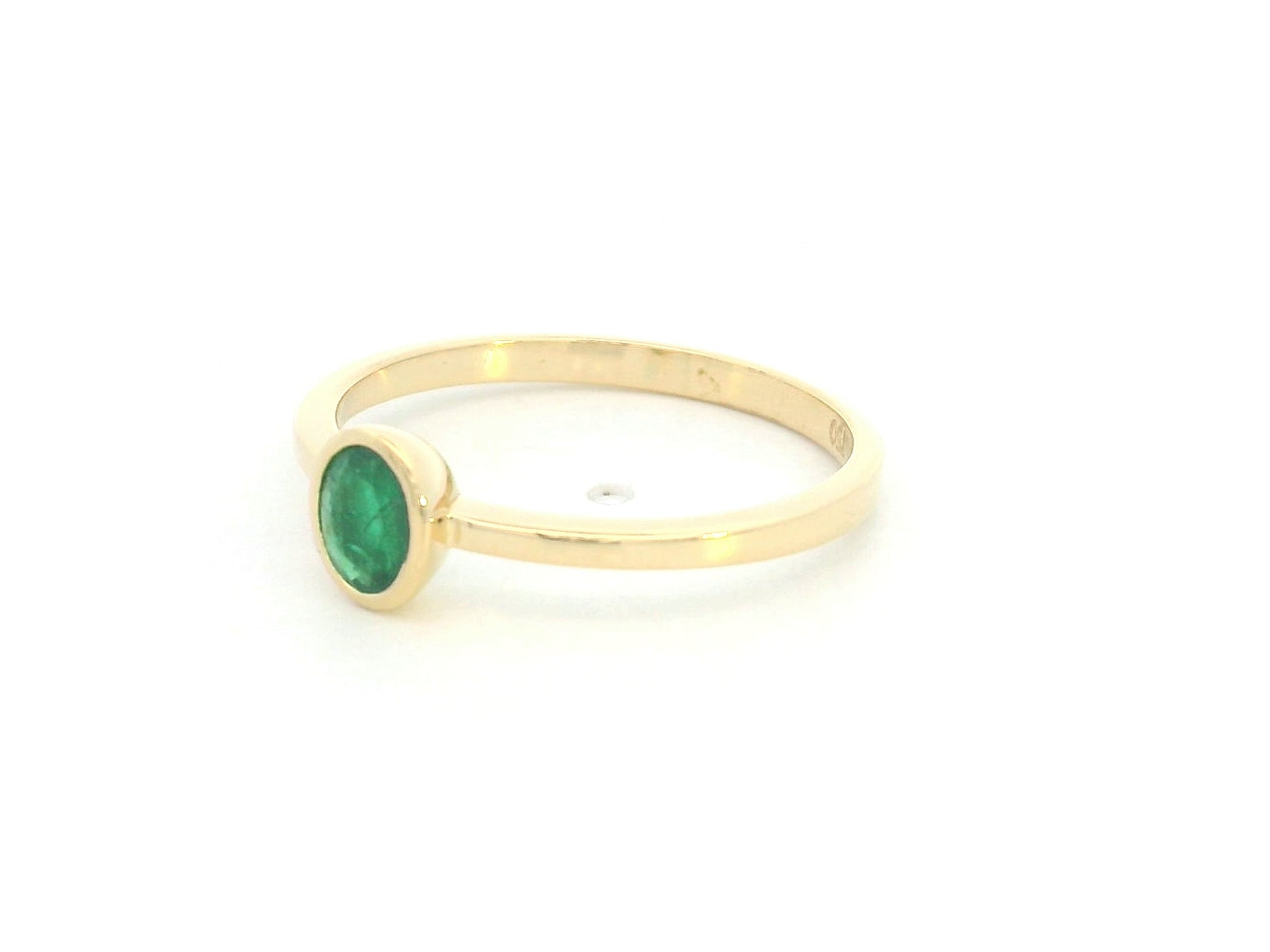 18K yellow gold emerald solitaire ring with bezel setting by Emirates Diamonds