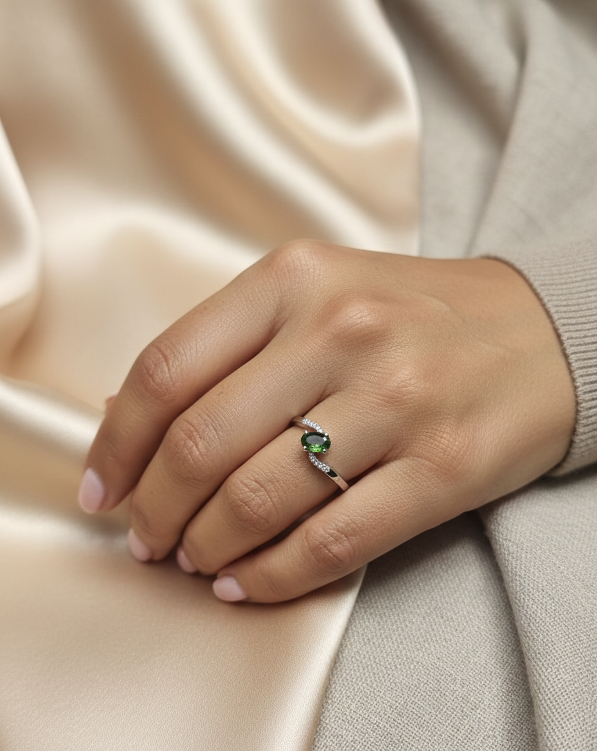 0.86 carat oval green sapphire and diamond ring in 18K white gold by Emirates Diamonds