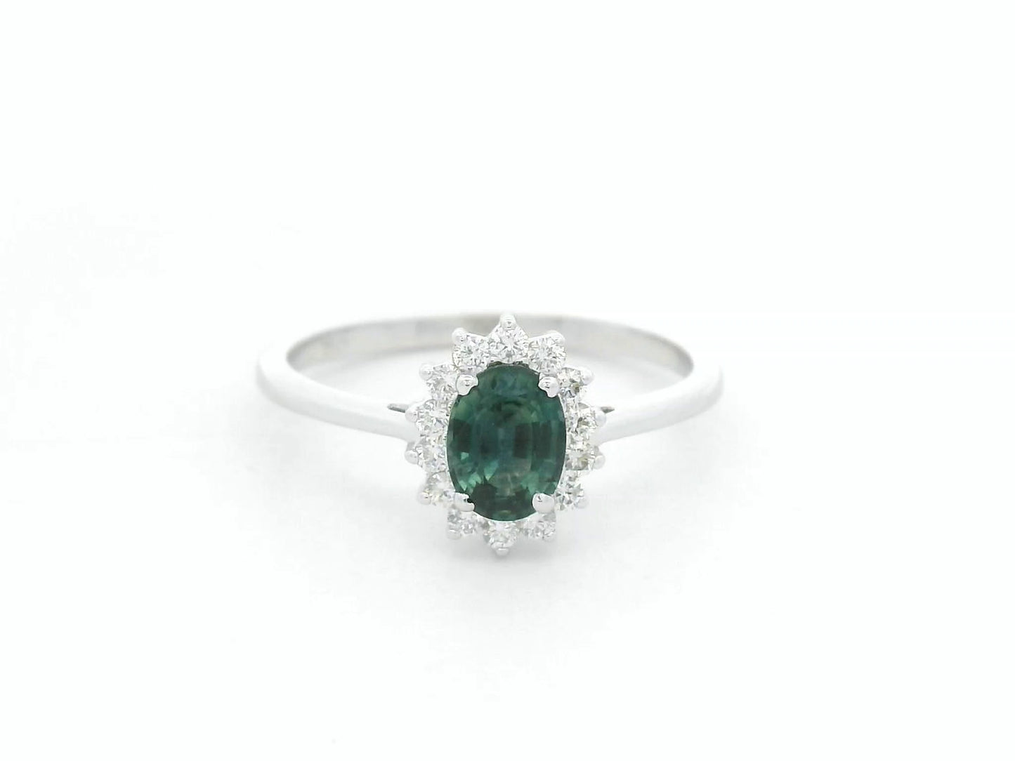0.74 carat oval green sapphire and diamond halo ring in 18K white gold by Emirates Diamonds