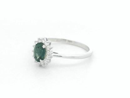 0.74 carat oval green sapphire and diamond halo ring in 18K white gold by Emirates Diamonds