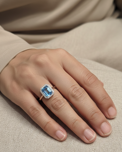 18K white gold Swiss blue topaz ring with diamond halo – emerald cut 2.35 carat topaz fine jewelry by Emirates Diamonds