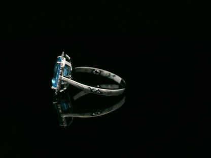18K white gold Swiss blue topaz ring with diamond halo – emerald cut 2.35 carat topaz fine jewelry by Emirates Diamonds