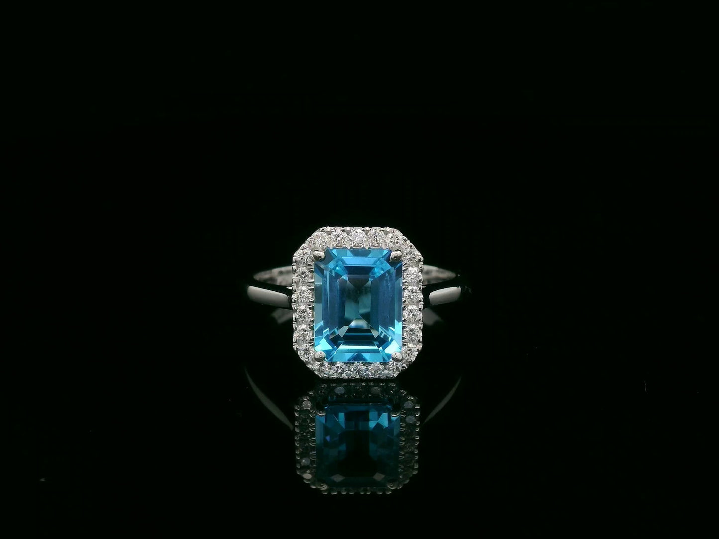 18K white gold Swiss blue topaz ring with diamond halo – emerald cut 2.35 carat topaz fine jewelry by Emirates Diamonds