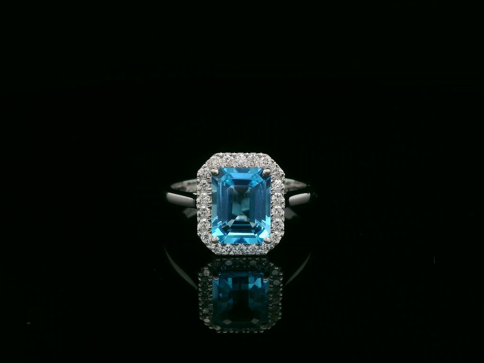18K white gold Swiss blue topaz ring with diamond halo – emerald cut 2.35 carat topaz fine jewelry by Emirates Diamonds