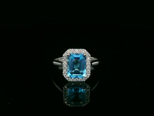 18K white gold Swiss blue topaz ring with diamond halo – emerald cut 2.35 carat topaz fine jewelry by Emirates Diamonds