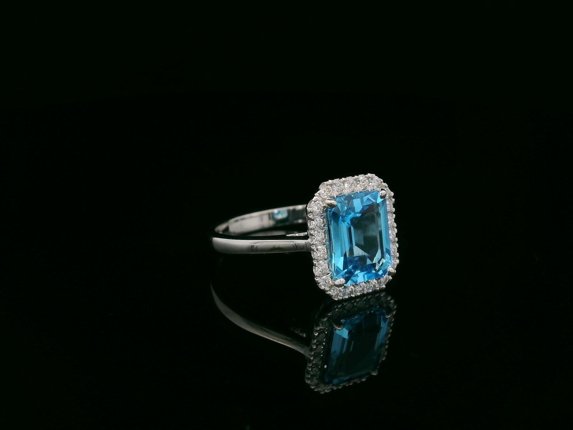 18K white gold Swiss blue topaz ring with diamond halo – emerald cut 2.35 carat topaz fine jewelry by Emirates Diamonds