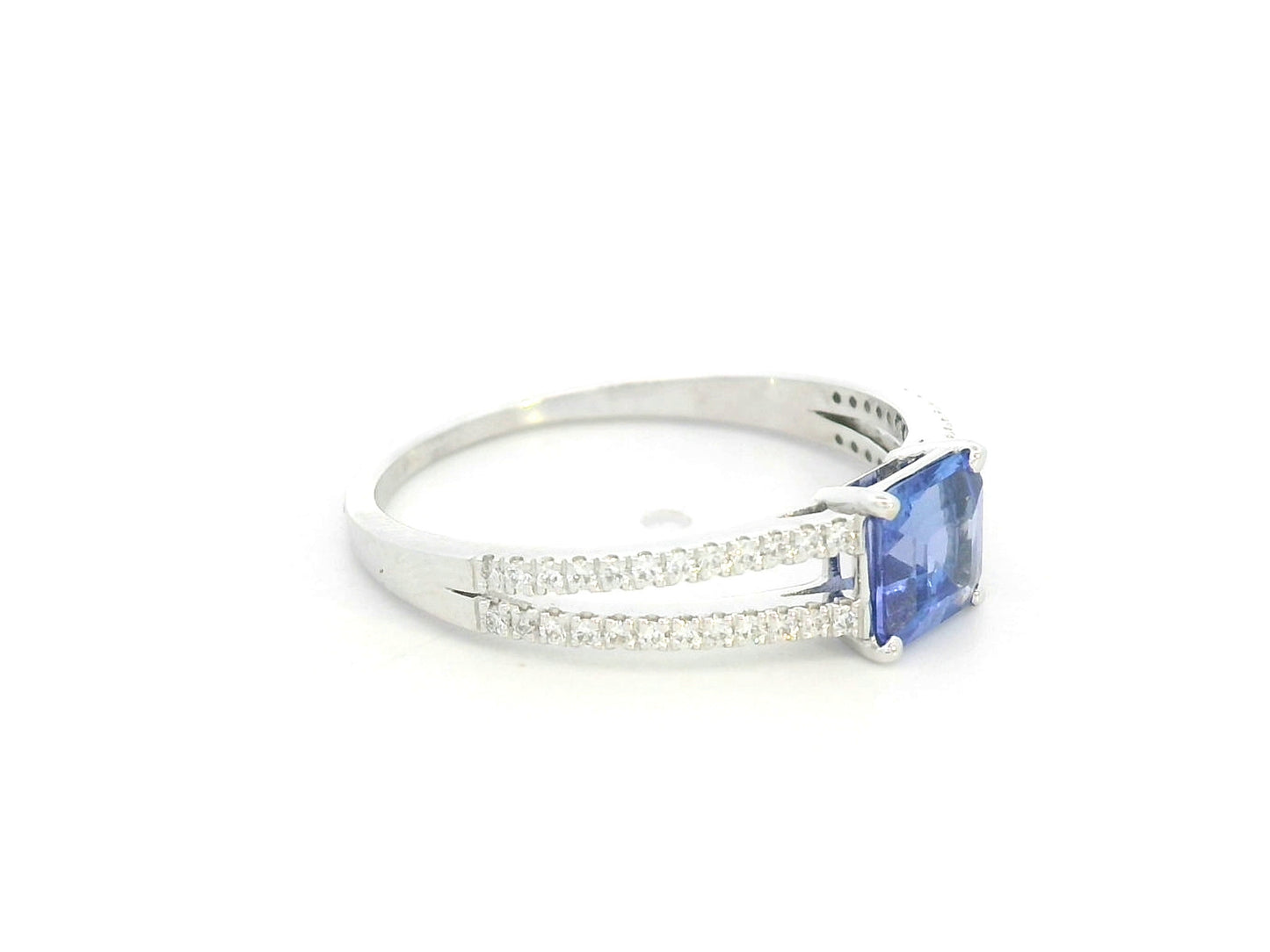 18K white gold split shank ring featuring 0.78 carat square-cut tanzanite and 0.16 carat diamond pavé band by Emirates Diamonds.