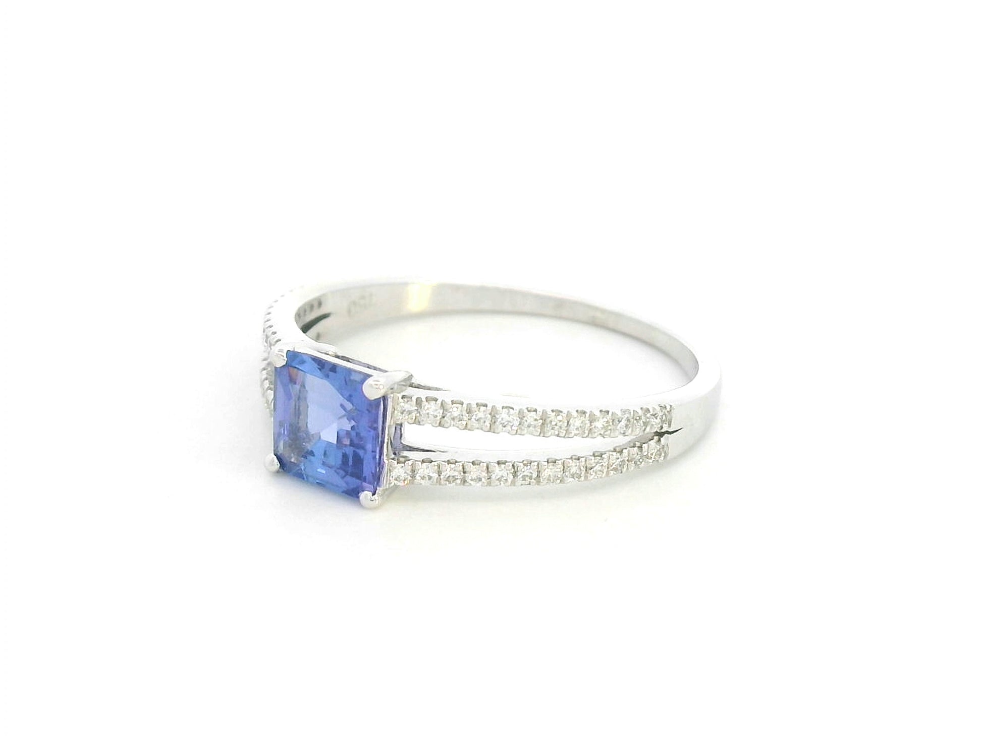 18K white gold split shank ring featuring 0.78 carat square-cut tanzanite and 0.16 carat diamond pavé band by Emirates Diamonds.
