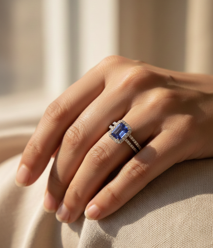 18K white gold tanzanite and diamond bridal ring set with halo engagement ring and diamond wedding band by Emirates Diamonds