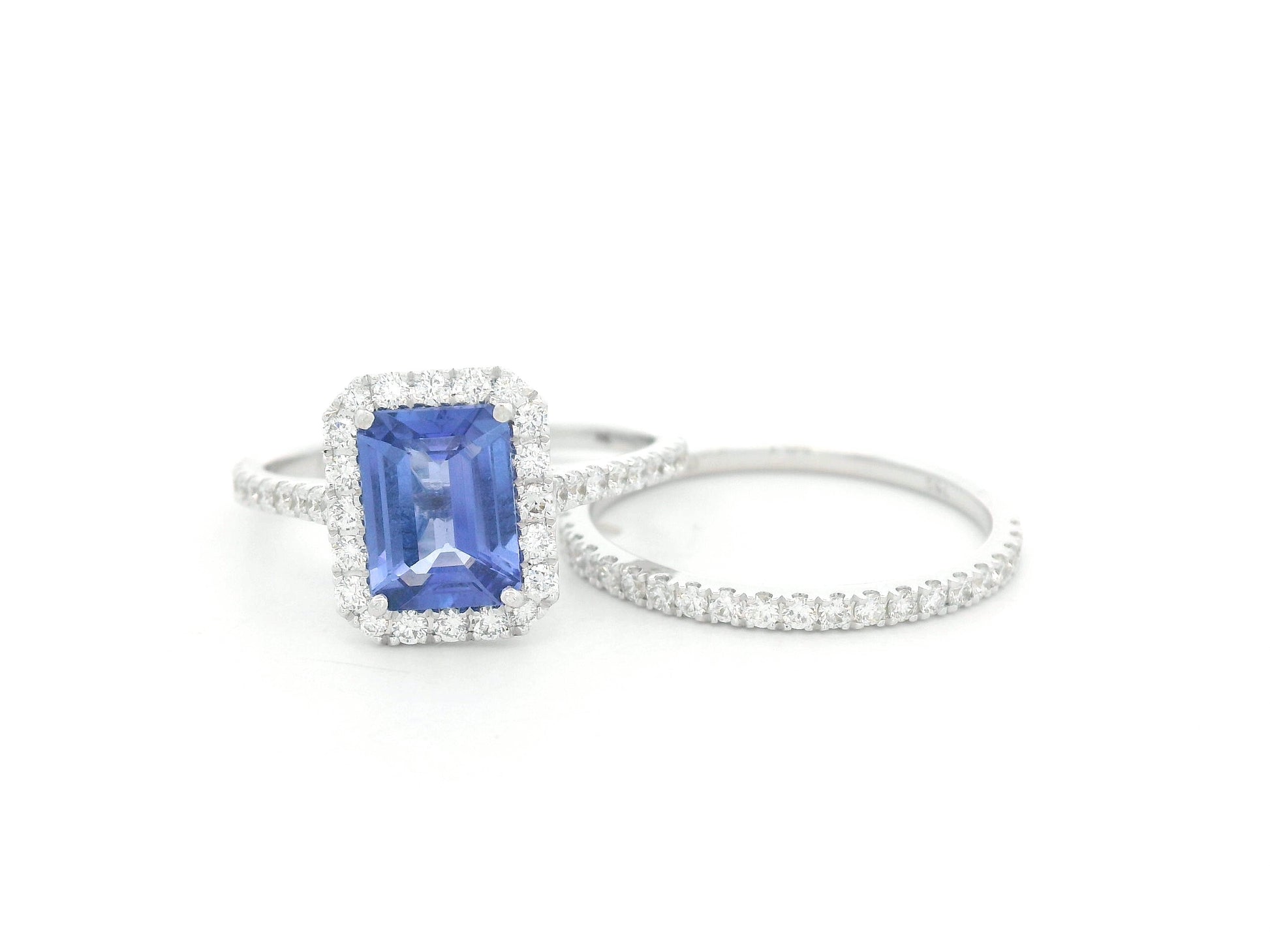 18K white gold tanzanite and diamond bridal ring set with halo engagement ring and diamond wedding band by Emirates Diamonds