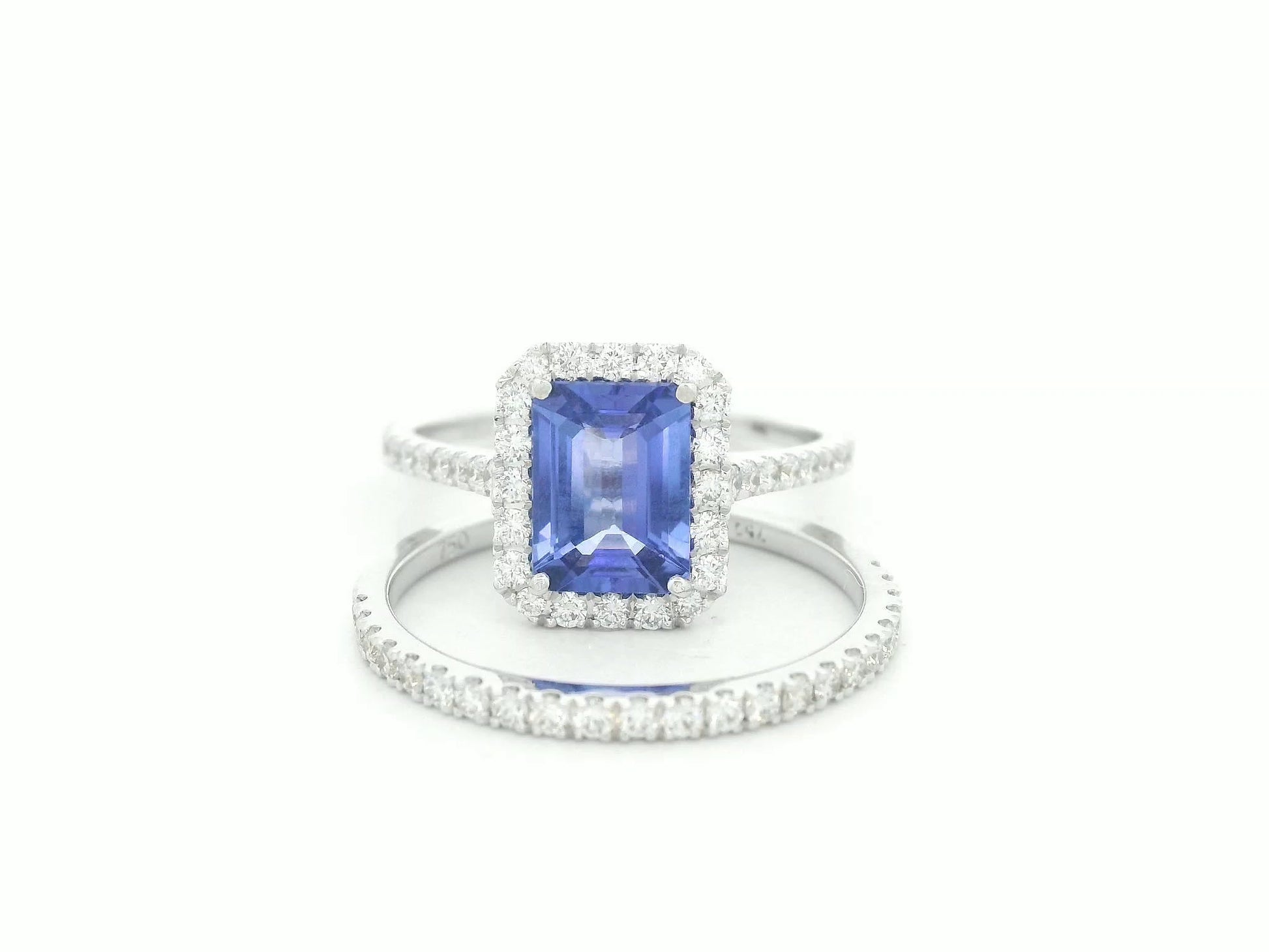 18K white gold tanzanite and diamond bridal ring set with halo engagement ring and diamond wedding band by Emirates Diamonds