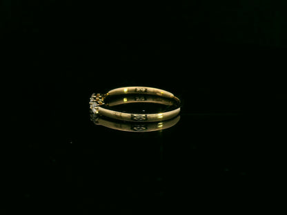 18K yellow gold diamond three-stone ring with round brilliant diamonds, classic trilogy ring design by Emirates Diamonds